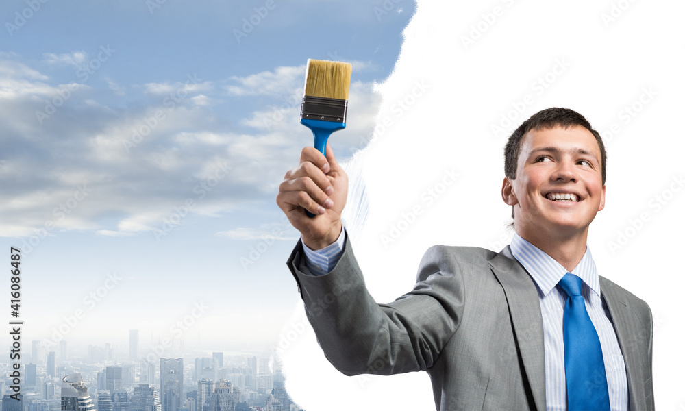 Creative businessman painter holding paintbrush Creative businessman painter holding paintbrush