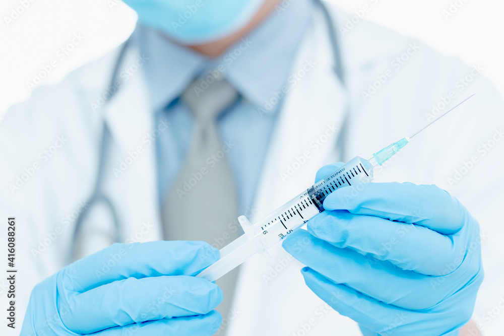 vaccines fight against virus covid-19 corona virus, doctor or scientist in laboratory holding a syringe with liquid vaccines. vaccines fight against virus covid-19 corona virus, doctor or scientist in laboratory holding a syringe with liquid vaccines.