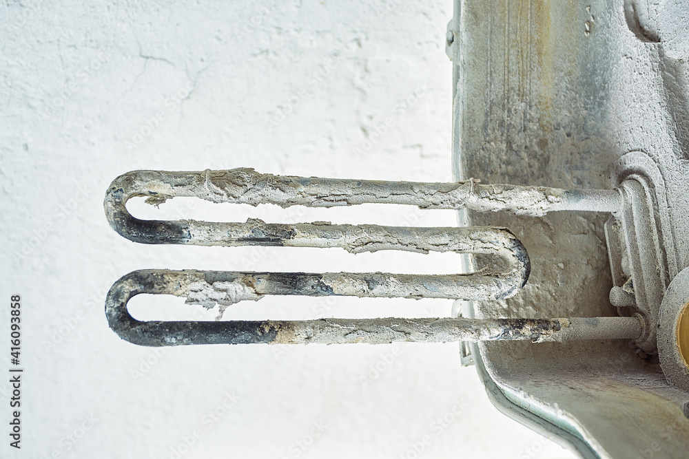 faulty washing machine heater. place and scale on the heating element