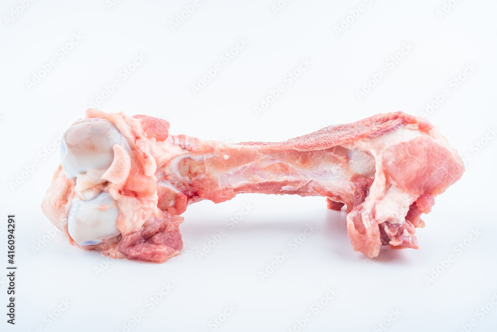 A fresh pork tube bone on white background