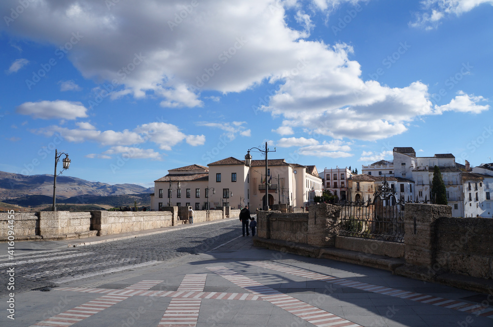 Square before entrance to the bridge Puente Nuevo in Ronda in sunny day