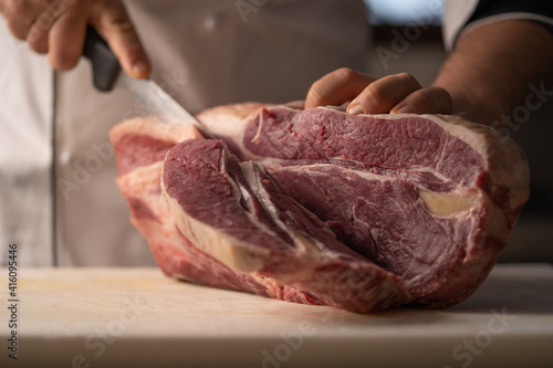 butcher processes the meat in the butchery