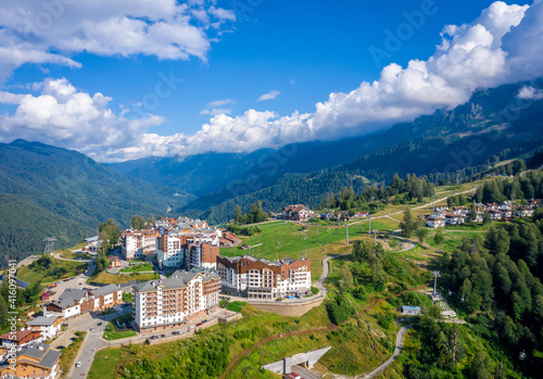 Summer aerial view of the Ski Resort Rosa Khutor. A complex of hotels on the site of the former Olympic village of Rosa Plateau at an altitude of 1170 m from sea level. Krasnaya Polyana, Sochi, Russia
