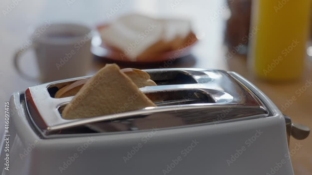 Burning Toast Pops Up In Toaster. Roasted toast bread popping up from