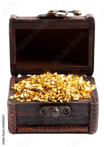Pieces of Gold in a Treasure Chest on a White Background