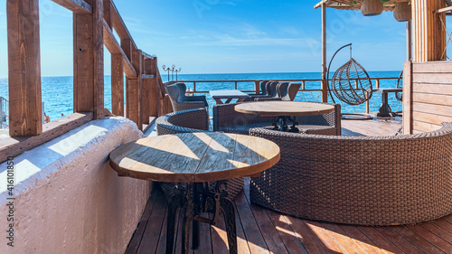 cozy cafe with wooden chairs and tables on the Black Sea coast