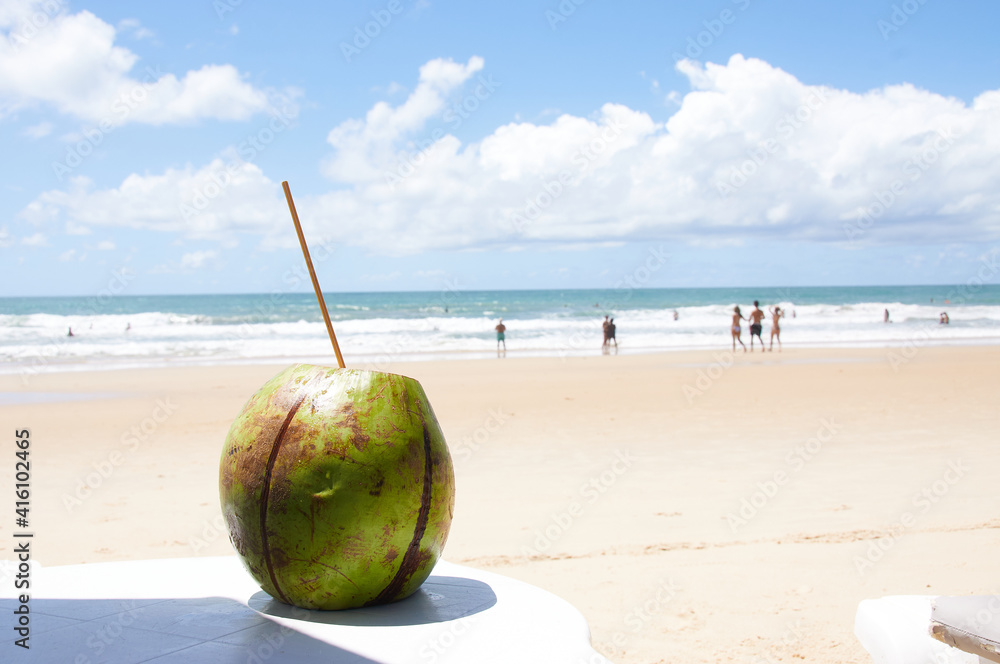 Drink fresh coconut water directly from the coconut in paradisiacal beach Drink fresh coconut water directly from the coconut in paradisiacal beach
