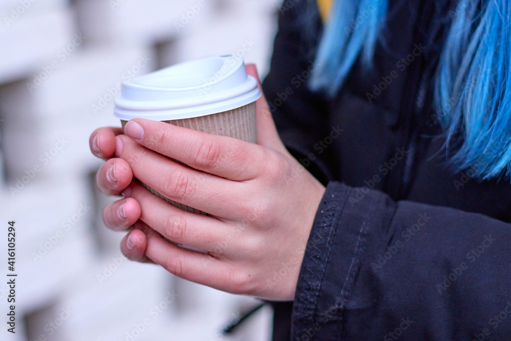 person with a cup of coffee