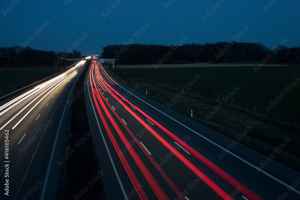 Night Autobahn, highway. Light lines from cars.