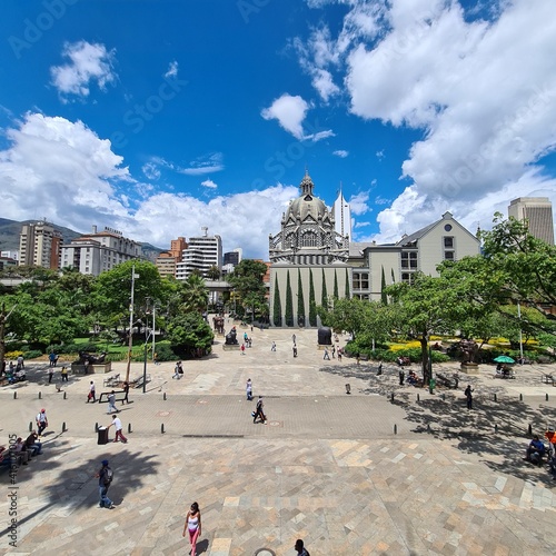 Medellin, Antioquia, Colombia. July 8, 2020: Botero Square and sculptures with a beautiful blue sky in the city. photo