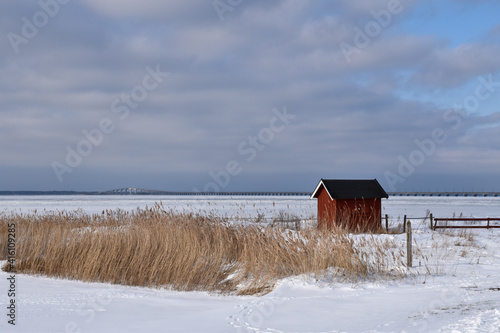 Ice covered coast with view at the Oland Bridge in Sweden