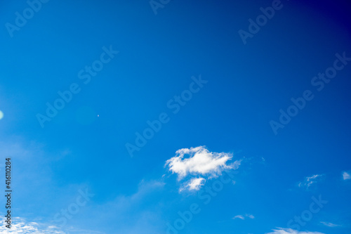 Blue sky with scattered blue clouds