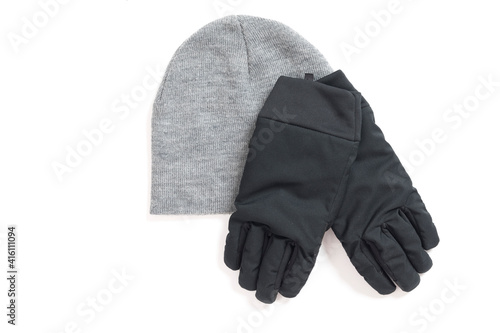 Grey knitted mens hat and gloves isolated on a white background. 