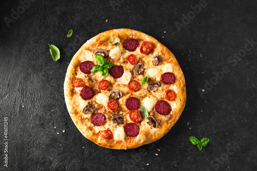 Pepperoni pizza with mushrooms and mozzarella