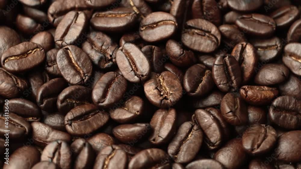 CloseUp Roasted coffee bean.Slow Motion Close Up of Whole Roasted Coffee Beans.Fragrant coffee beans scrolls slowly around the camera. CloseUp Roasted coffee bean.Slow Motion Close Up of Whole Roasted Coffee Beans.Fragrant coffee beans scrolls slowly around the camera.