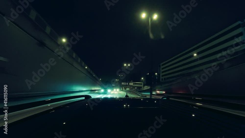 Driving through suburban tunnels at night, cars are following fast by looking behind over the owns cartop. Speed ramp effect in Munich, driving with highspeed. photo