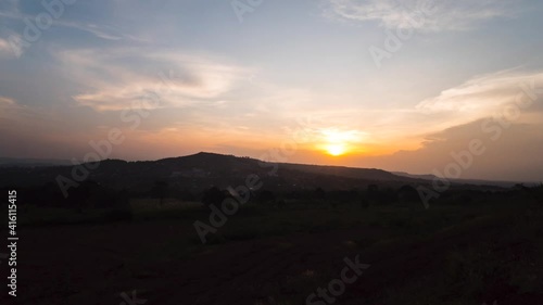 Wallpaper Mural A zoom in time lapse of the sun setting over a mountain in rural Africa. Torontodigital.ca