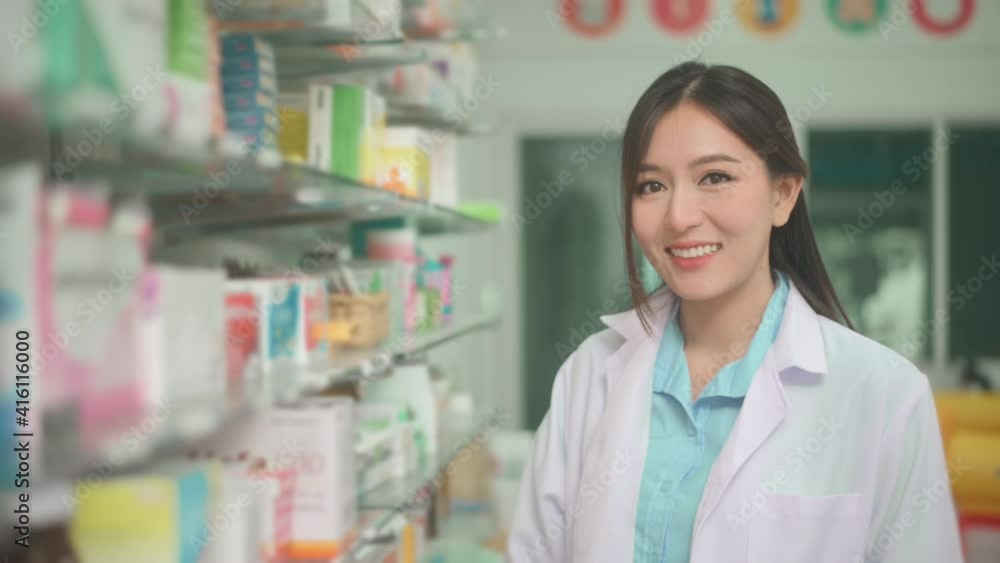 Portrait of asian woman pharmacist wearing lab coat in a modern pharmacy drugstore. Portrait of asian woman pharmacist wearing lab coat in a modern pharmacy drugstore.