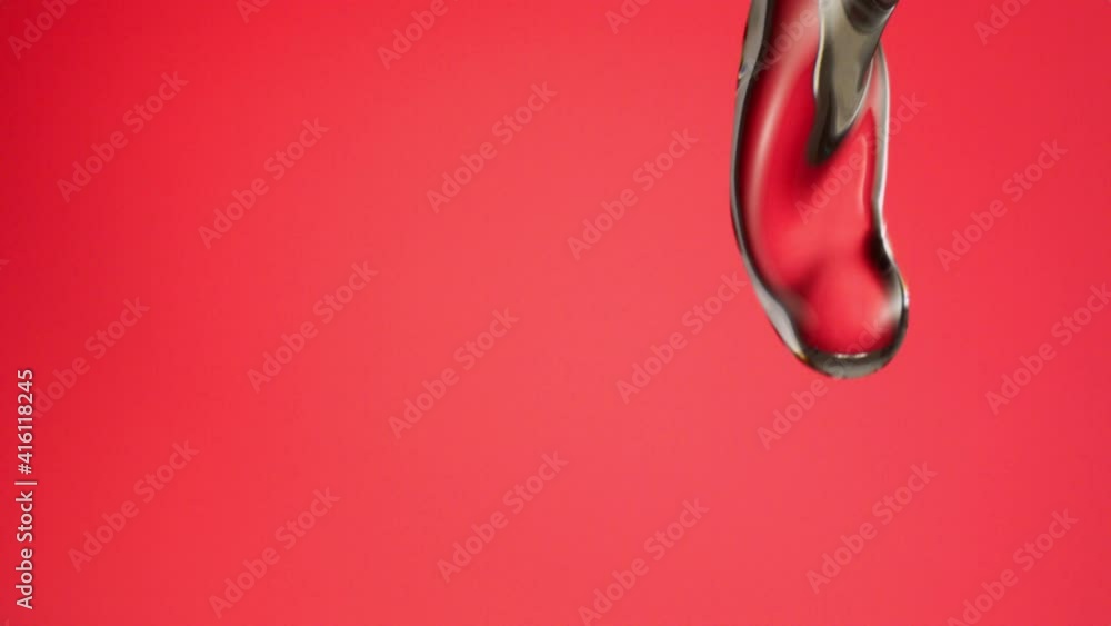 Macro shot of water stream falling in slow motion