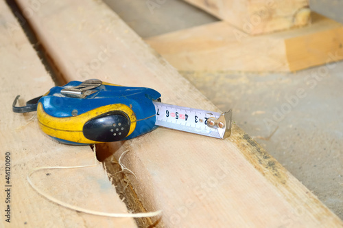 old blue roulette lies on wooden boards at a construction site photo