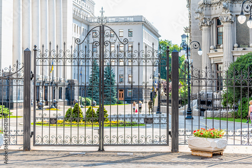 Kyiv, Ukraine Ukrainian parliament building Verhovna Rada with closed gate for security in Kiev and people in bokeh background photo