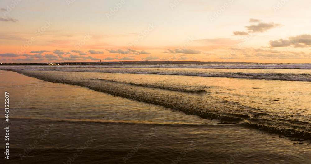 Obraz premium beautiful panoramic view of Asian beach - sunset orange sky over Bali island in Indonesia in travel destination and exotic Summer holidays concept