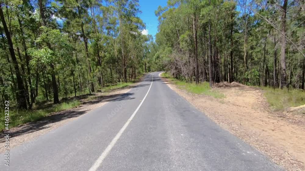 Rear facing driving point of view POV of a deserted Queensland country road with dry dusty tracks - ideal for interior car scene green screen replacement Rear facing driving point of view POV of a deserted Queensland country road with dry dusty tracks - ideal for interior car scene green screen replacement