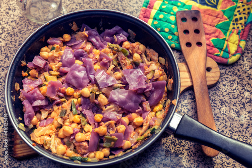 sauteed chickpeas with red cabbage and vegetables. healthy meal