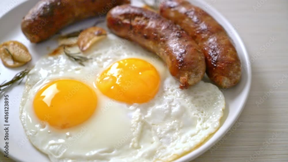 homemade double fried egg with fried pork sausage - for breakfast homemade double fried egg with fried pork sausage - for breakfast