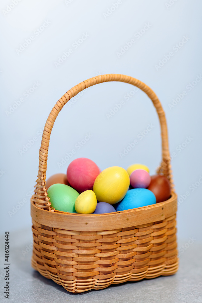 a basket full of colorful colored eggs for the Easter holiday