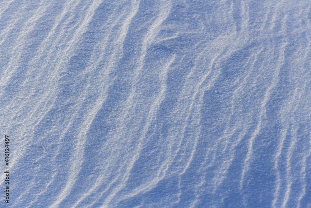 Snowy surface. Wavy contours. Crystals shine in the sun. Snowy surface. Wavy contours. Crystals shine in the sun.