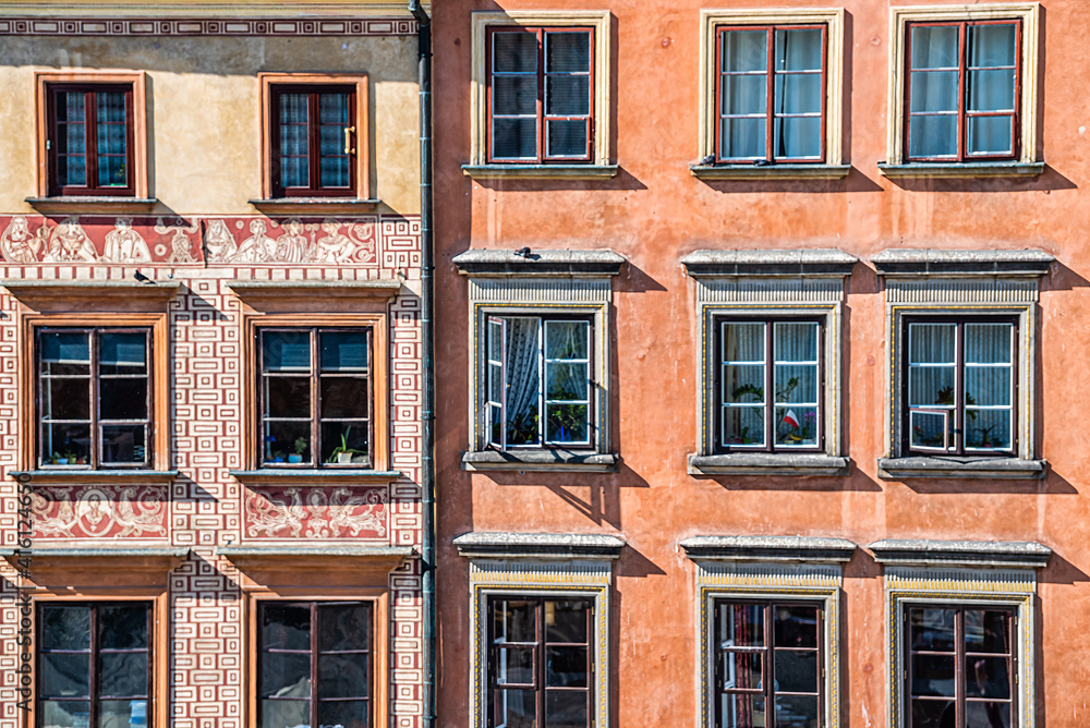 Warsaw, Poland closeup of wall in rynek old town market square with historic architecture windows closeup pattern of orange brown colors