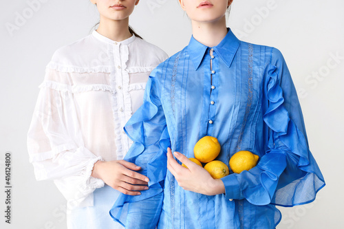 Girls with lemons. Fashion photography