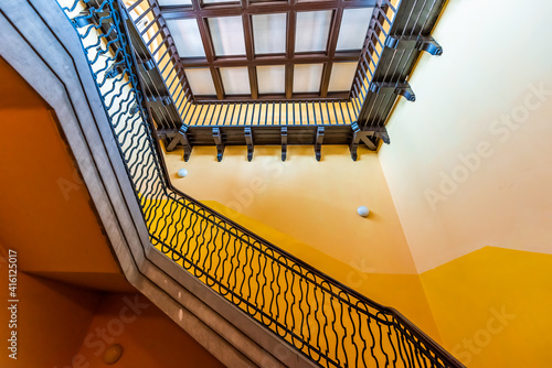 Εκτύπωση καμβά View of old vintage staircase with yellow color in Warsaw, Europe tenement in ol