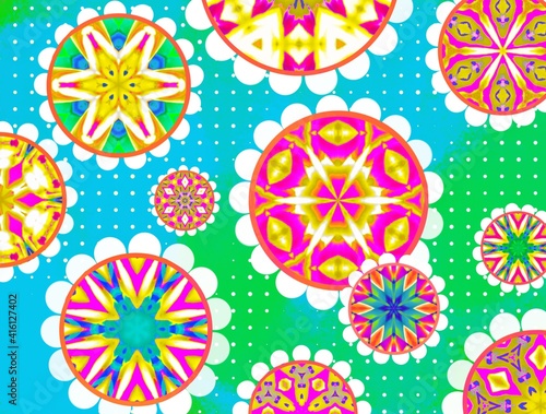 Bright colorful floral textile pattern with abstract flowers on a green and blue background.