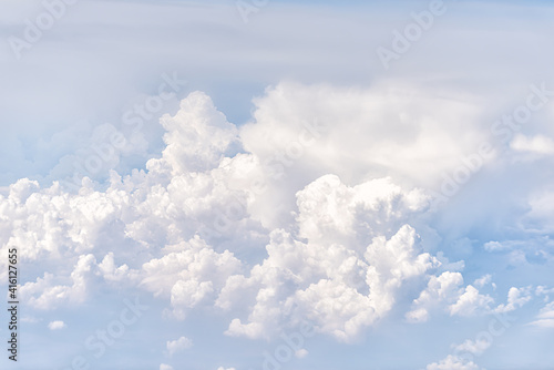 Above high angle view of sky cloudscape with fluffy clouds and bright soft sunny sunlight aerial view of Europe from airplane