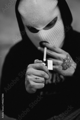 gangster lighting up a cigarette photo