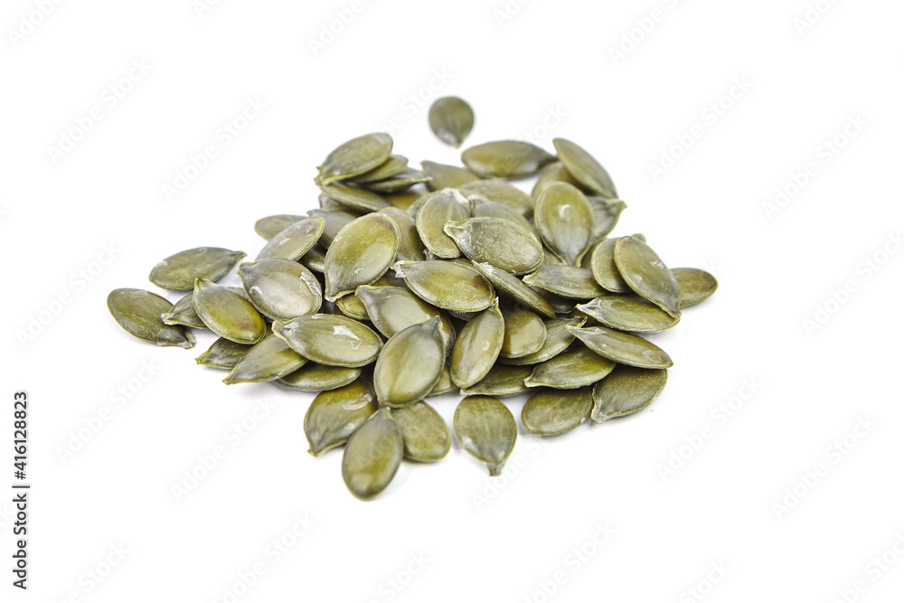 Pumpkin seeds isolated on a white background. Heap of dry pumpkin seeds Pumpkin seeds isolated on a white background. Heap of dry pumpkin seeds