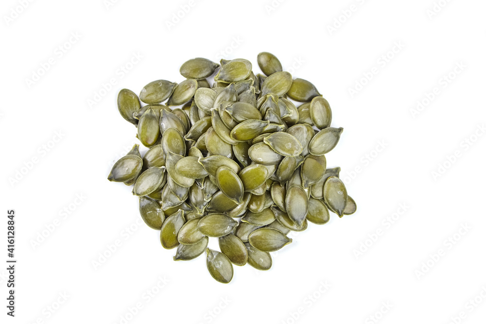 Pumpkin seeds isolated on a white background. Heap of dry pumpkin seeds Pumpkin seeds isolated on a white background. Heap of dry pumpkin seeds