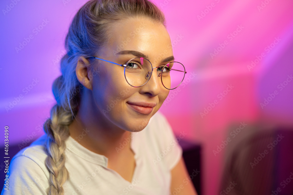 Portrait of Gamer Girl with Glasses Playing Online Video Game on Her Computer Portrait of Gamer Girl with Glasses Playing Online Video Game on Her Computer