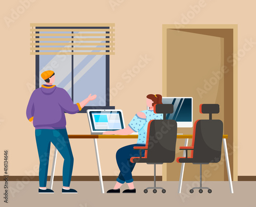 A man and a woman sitting at a table, communicating programmers develop new program code. Businesspeople discuss a project. Business meeting, working process in office workspace with computer