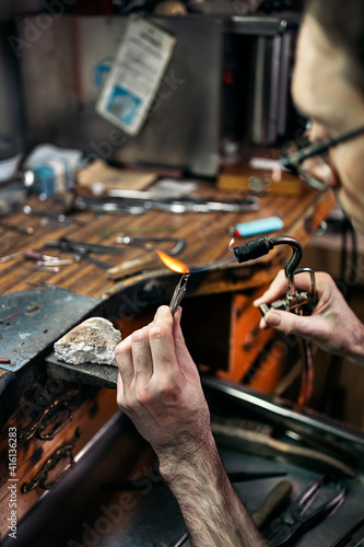 Hands of an artisan Making Handmade Jewelry