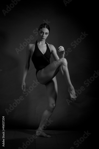 black and white vintage dramatic portrait of a dancing girl-ballerina