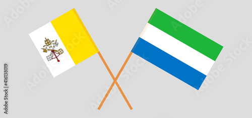 Crossed flags of Vatican and Sierra Leone. Official colors. Correct proportion