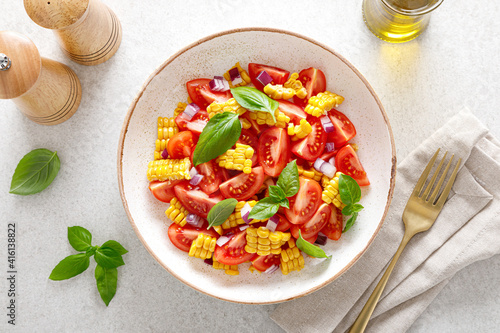 Tomato and corn salad with fresh basil and red onion