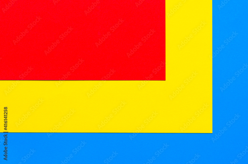 Fototapeta premium Red yellow blue geometric background. A multi-colored abstract background