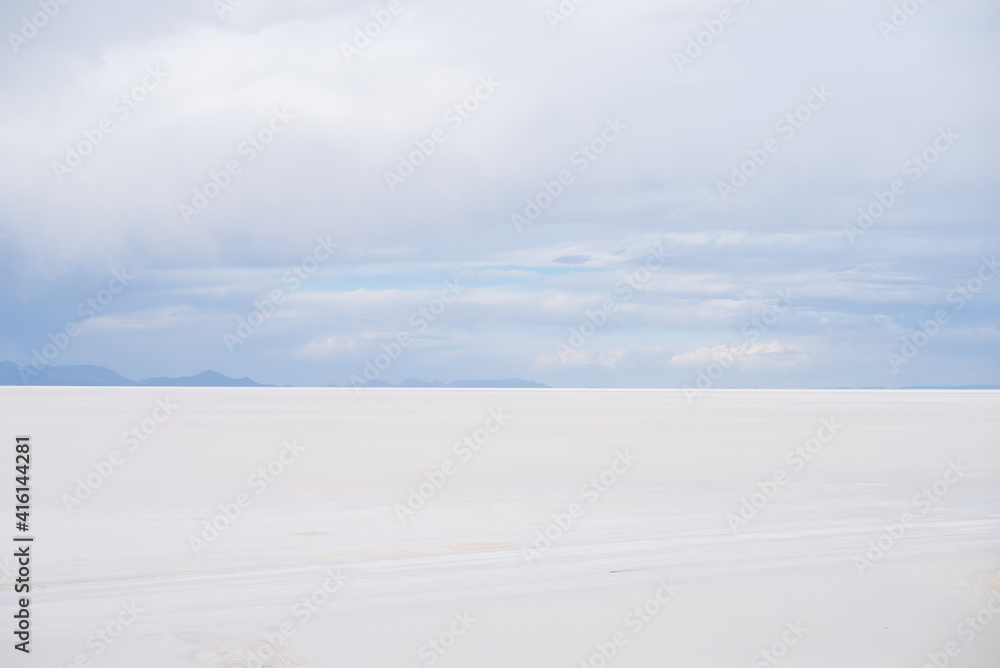 Beautiful Bolivia's Salt Flats. Shot in Salar de Uyuni salt flat. Water reflection of clouds and empty space. 