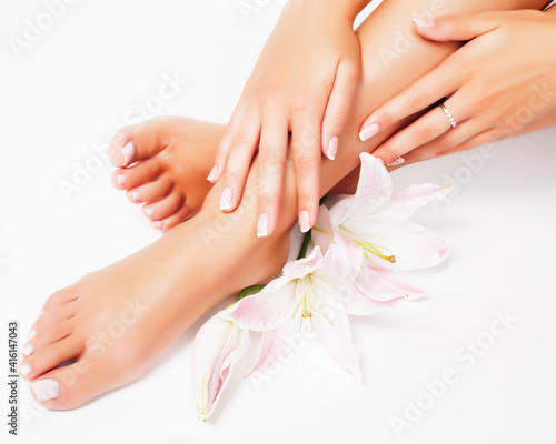 manicure pedicure with flower lily closeup isolated on white perfect shape hands spa salon