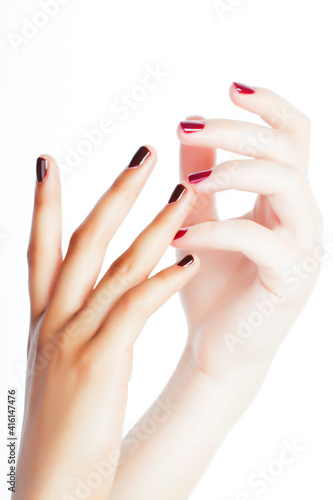 two different nathion manicured hands on white isolated  african with caucasian