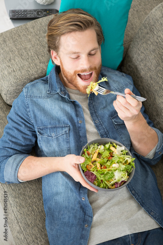 happy man eating a salad